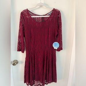 Fishbowl XL burgundy mini dress with a black slip attached.